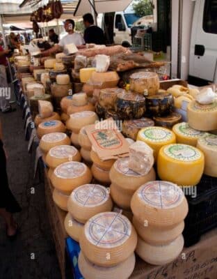 cheese stall at a farmers market in alghero sardinia CXGN6D